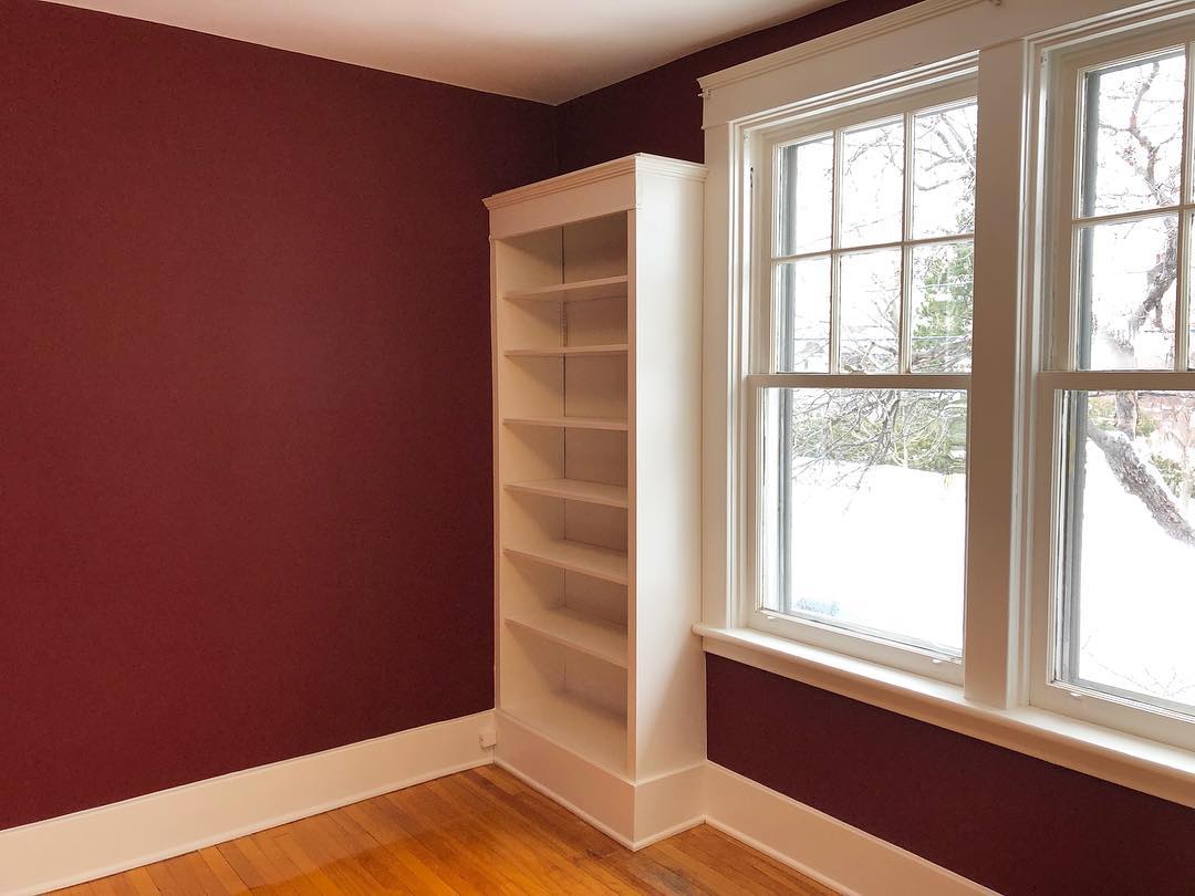 Red wall painting with white trim, Dubai move-out